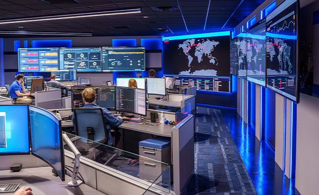 Security Operations Center with cyber specialists monitoring and assisting