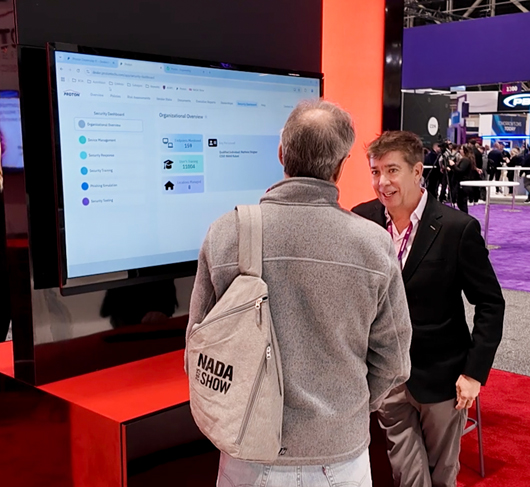 Image of two men talking at a convention